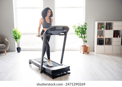 Photo of nice adorable active girl going running physical exercises in gym daylight interior indoors - Powered by Shutterstock