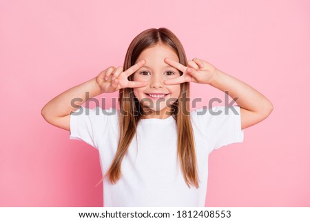 Photo of nice adorable pretty kid enjoy spring free time make v-sign wear good look clothes isolated over pink color background