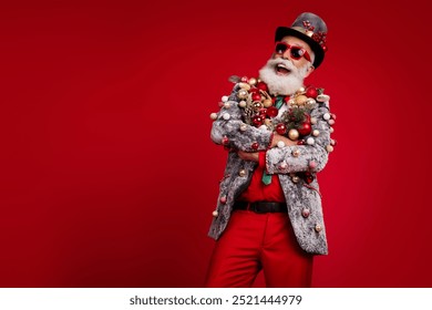 Photo of nice aged elegant man crossed hands excited wear christmas tree balls costume sunglasses isolated red color background - Powered by Shutterstock