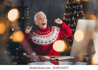 Photo of nice aged woman stretch hands yawn use computer christmas festive illumination apartment indoors - Powered by Shutterstock