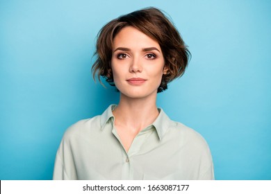 Photo Of Nice Attractive Business Lady Short Bob Hairstyle Not Smiling Serious Responsible Person Wear Casual Formalwear Green Shirt Isolated Blue Color Background