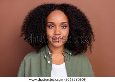 Photo of nice brunette young afro hairstyle lady wear khaki shirt isolated on brown color background