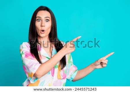 Photo of nice lady indicate fingers empty space wear shirt isolated on turquoise color background