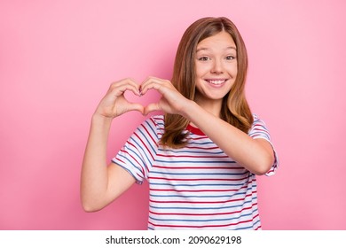Photo of nice little brown hairdo girl show heart wear red t-shirt isolated on pink color background - Shutterstock ID 2090629198