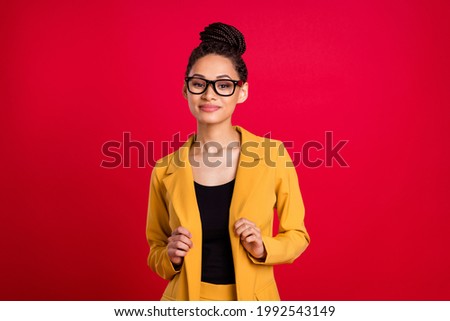 Photo of nice millennial lady touch cardigan wear eyewear isolated on vivid red color background