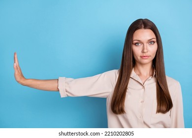 Photo Of Nice Upset Young Girl Stretch Hand Showing Aside Decline Gesture Wear Stylish Smart Casual Look Isolated On Blue Color Background