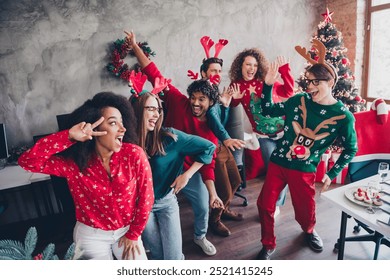 Photo of nice young people team employees dancing celebrate enjoy cozy christmas decoration interior office indoors corporate party - Powered by Shutterstock