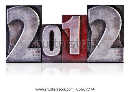 Photo of the number 2012 in old metal letterpress, isolated on a white background.