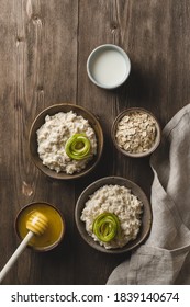 A Photo Of Oatmeal With Pear And Honey On The Brown Wood. Flat Lay Photo