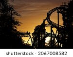 Photo of the Oblivion roller coaster at Alton Towers as the sun goes down.