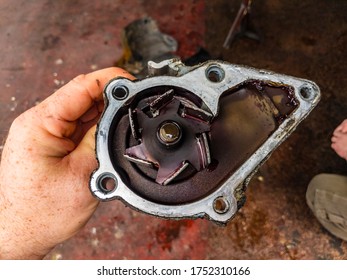 A Photo Of An Old Broken Car Water Pump