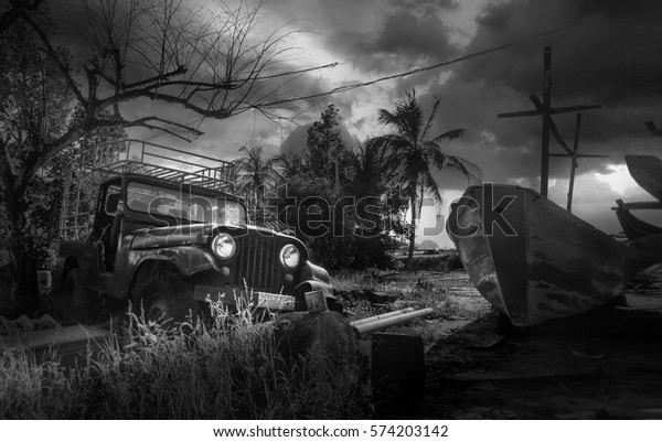 Photo with old car and old\
boat on tropical land,sky and vintage effect create dramatic\
atmosphere