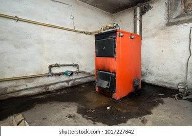 Photo of old furnace. Flowing water from bottom. - Shutterstock ID 1017227842