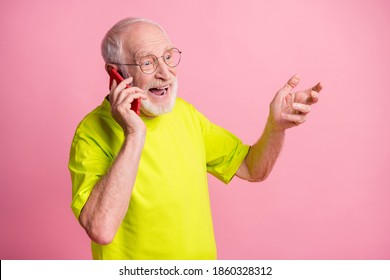 Photo of old happy cheerful excited grandfather wear lime t-shirt talk speak phone isolated on pink color background - Powered by Shutterstock