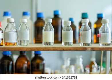 Photo Of An Old Laboratory With A Lot Of Bottles And Dirt