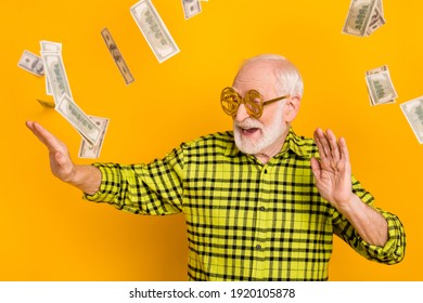 Photo Of Old Man Happy Smile Enjoy Dance Air Fly Cash Dollars Usd Money Wear Spectacles Isolated Over Yellow Color Background