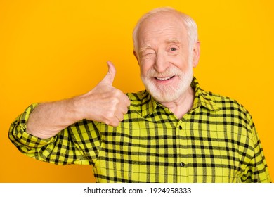 Photo Of Old Man Happy Smile Wink Eye Show Thumb-up Cool Like Ad Advice Choice Feedback Isolated Over Yellow Color Background