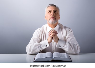 Photo Of Old Man Praying To God With Bible And Looking Up