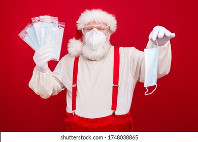 Photo Of Old Merry Santa Business Man Flu Medical Respirators Epidemic Internet Website Order Offer Five For Price Of One Wear Goggles Face Mask Hat Shirt Suspenders Isolated Red Background