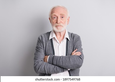 Photo Of Old Serious Man Crossed Arms Wear Dark Sweater Isolated On Grey Background