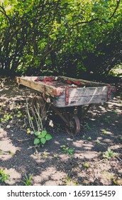 Photo Of An Old Wooden Wheel Barrow