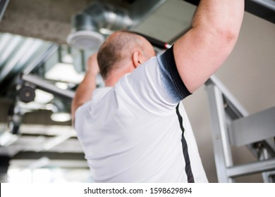 Photo Of Older Man Doing Pull-up Exercise In The Gym