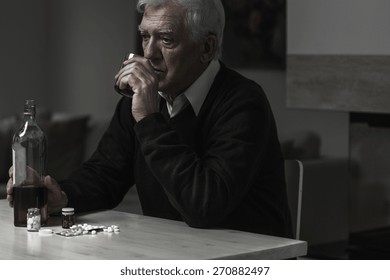 Photo Of Older Sad Man Drinking Alcohol Alone