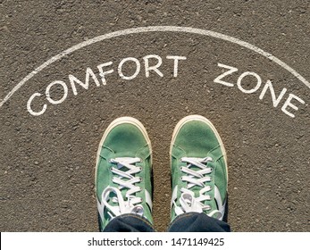 Photo On Top Of The Sneakers And The Inscription Comfort Zone On The Asphalt, The Concept Of Personal Private Space