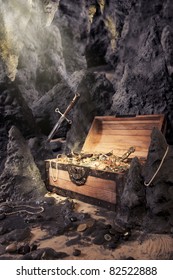 photo of open treasure chest with shinny gold in a cave