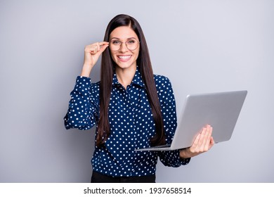 Photo of optimistic girl hold laptop wear spectacles blue blouse trousers isolated on grey color background