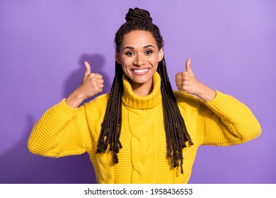 Photo of optimistic nice brunette girl show thumb up wear sweater isolated on purple background