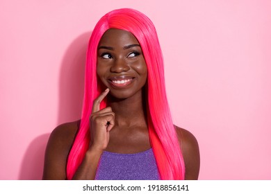 Photo of optimistic nice pink hairdo lady hand chin look empty space wear purple top isolated on pastel color background