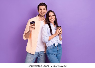 Photo of optimistic woman trust her boyfriend posing model hold fresh latte coffee more energy good morning isolated on violet color background - Powered by Shutterstock