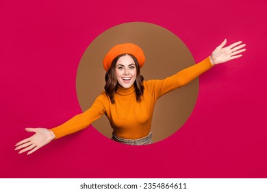 Photo of overjoyed glad petty lady inside pink paper hole open arm glad inviting welcome see you here isolated on beige color background - Powered by Shutterstock