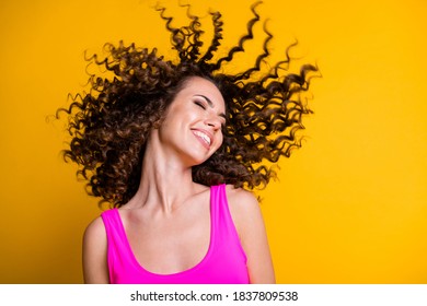 Photo of overjoyed gorgeous young lady good mood feel warm sea ocean summer breeze sun by skin eyes closed wavy hairdo flight wear pink singlet tank-top isolated shine yellow color background - Powered by Shutterstock