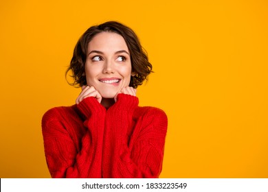 Photo of overjoyed lady dreamer look up empty space enjoy cloth warmth winter holidays think of celebrating family meeting gathering wear red knitted sweater isolated yellow color background