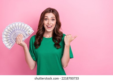 Photo Of Overjoyed Positive Lady Hand Arm Direct Empty Space Offer Proposition Casino Won Usd Banknotes Isolated On Pink Color Background