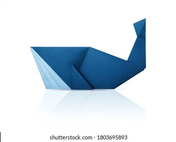 Photo of paper origami marine blue whale isolated on a white