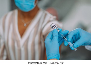 Photo Of Patient Getting A Vaccine In The Doctor's Office.