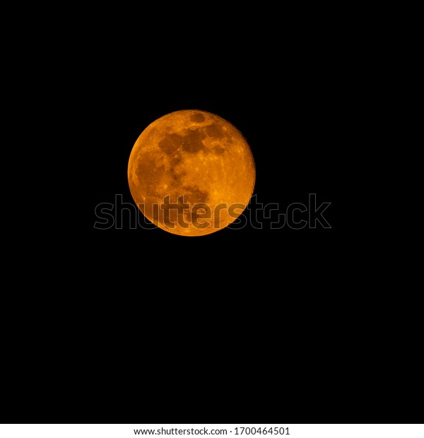 Photo of the\
‘Full Pink Moon’ captured on the 8th of April 2020. This pink moon\
gave the moon a bright orange glow to it matching the brightness of\
the previous days super\
moon.