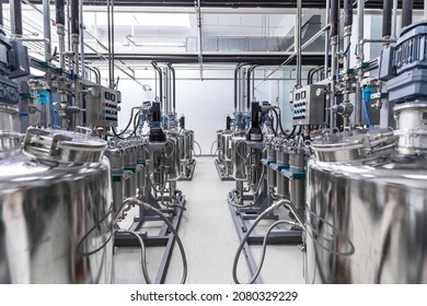 Photo of pipes and tanks. Chemistry and medicine production. Pharmaceutical factory. Interior of a high-tech plant, modern production