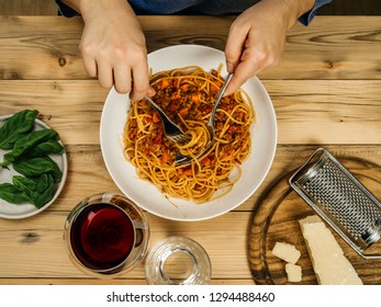 Photo Of A Plate Of Traditional Spaghetti Bolognese And Glass Of Red Wine From Above.