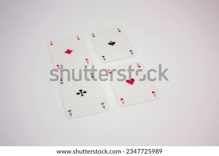 Photo of playing cards with square aces.