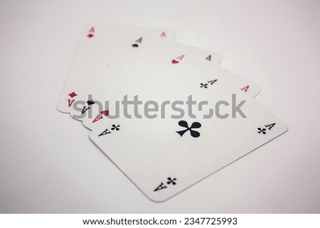 Photo of playing cards with square aces.
