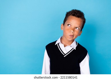 Photo Of Ponder Pensive Little Guy Dressed Black Vest Looking Empty Space Isolated Blue Color Background