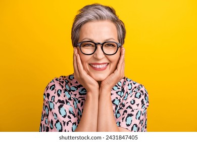 Photo portrait of attractive pensioner woman touch cheeks dreamy dressed stylish leopard print clothes isolated on yellow color background - Powered by Shutterstock