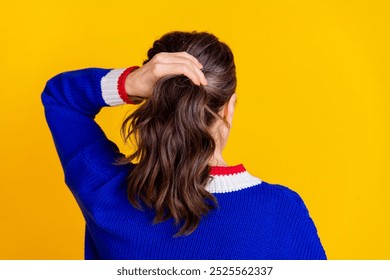 Photo portrait of attractive retired woman back view ponytail dressed stylish blue knitted clothes isolated on yellow color background - Powered by Shutterstock