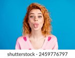 Photo portrait of attractive young woman stick tongue out dressed stylish pink clothes isolated on blue color background