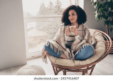 Photo portrait of attractive young woman sit armchair drink coffee dressed casual clothes cozy day light home interior living room - Powered by Shutterstock