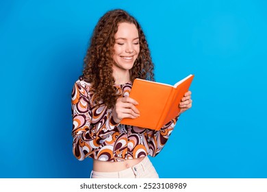 Photo portrait of attractive young woman read book dressed stylish colorful clothes isolated on blue color background - Powered by Shutterstock